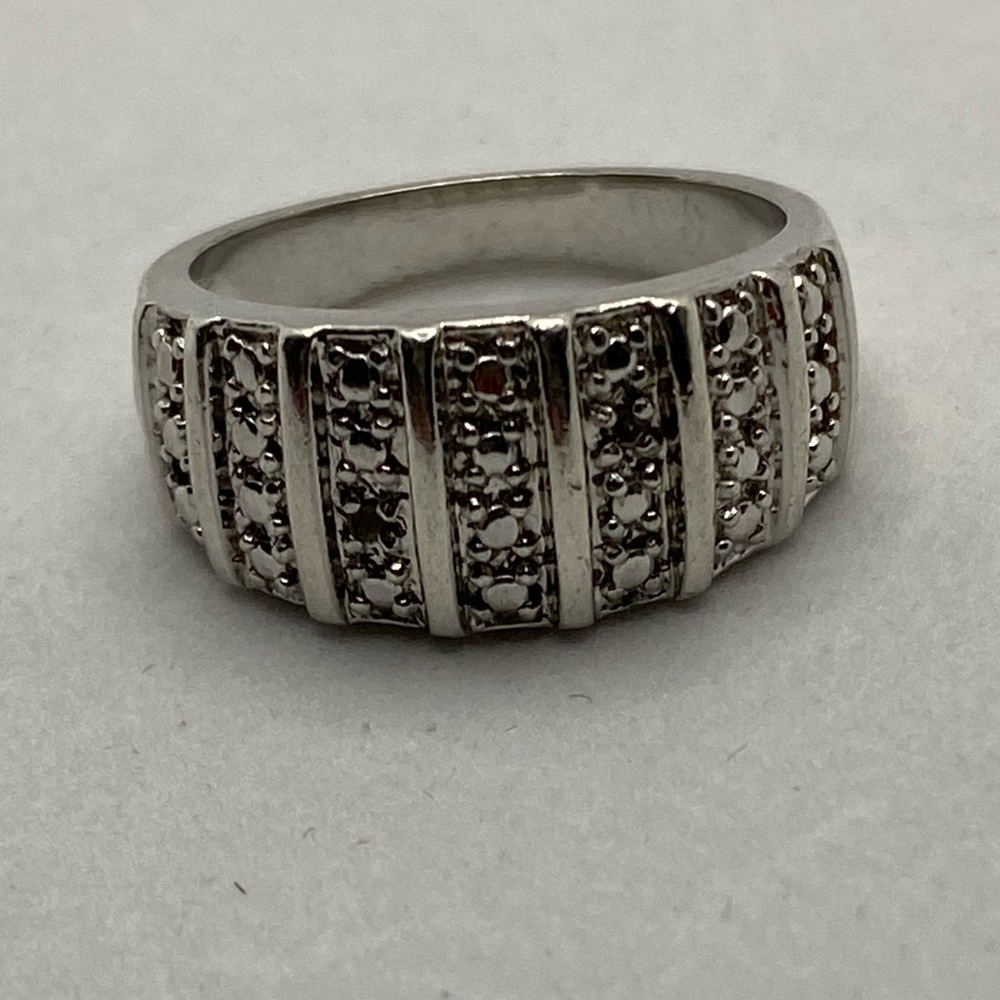 Sterling Silver Ring with .01 tcw Diamonds.